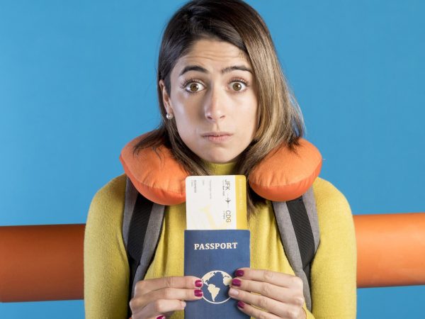 front-view-woman-holding-passport